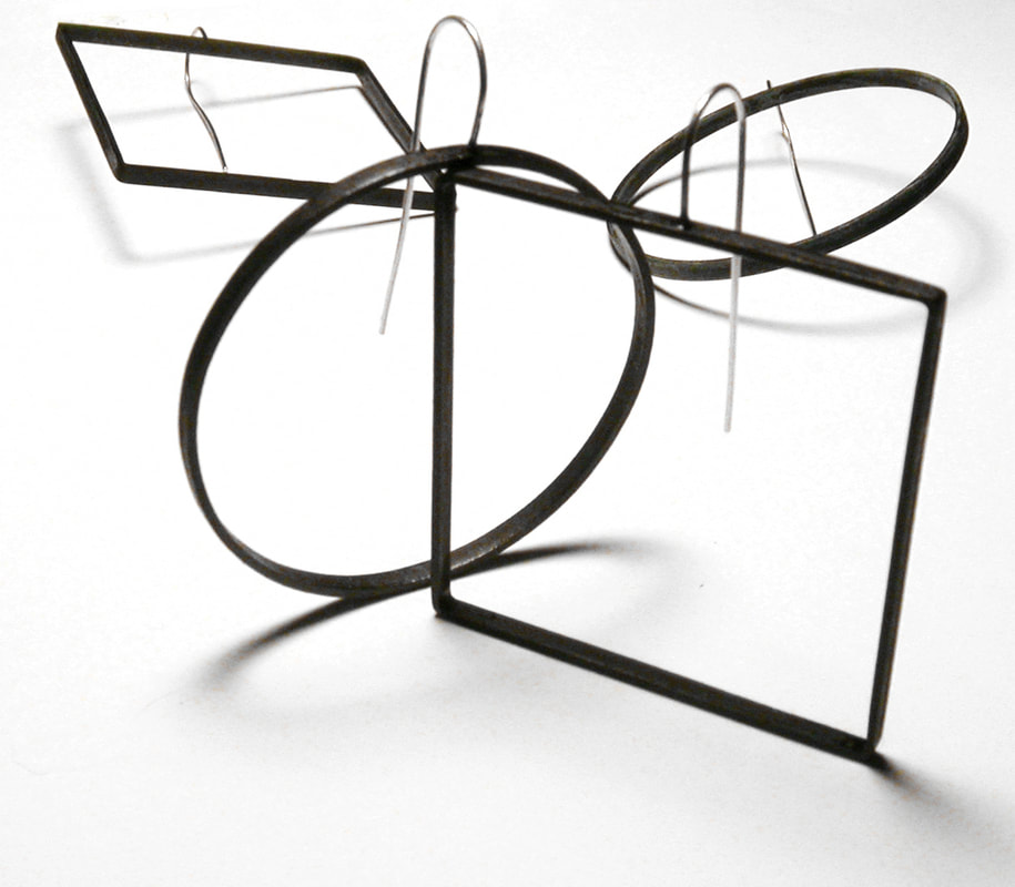 the big squares and circles in black brass