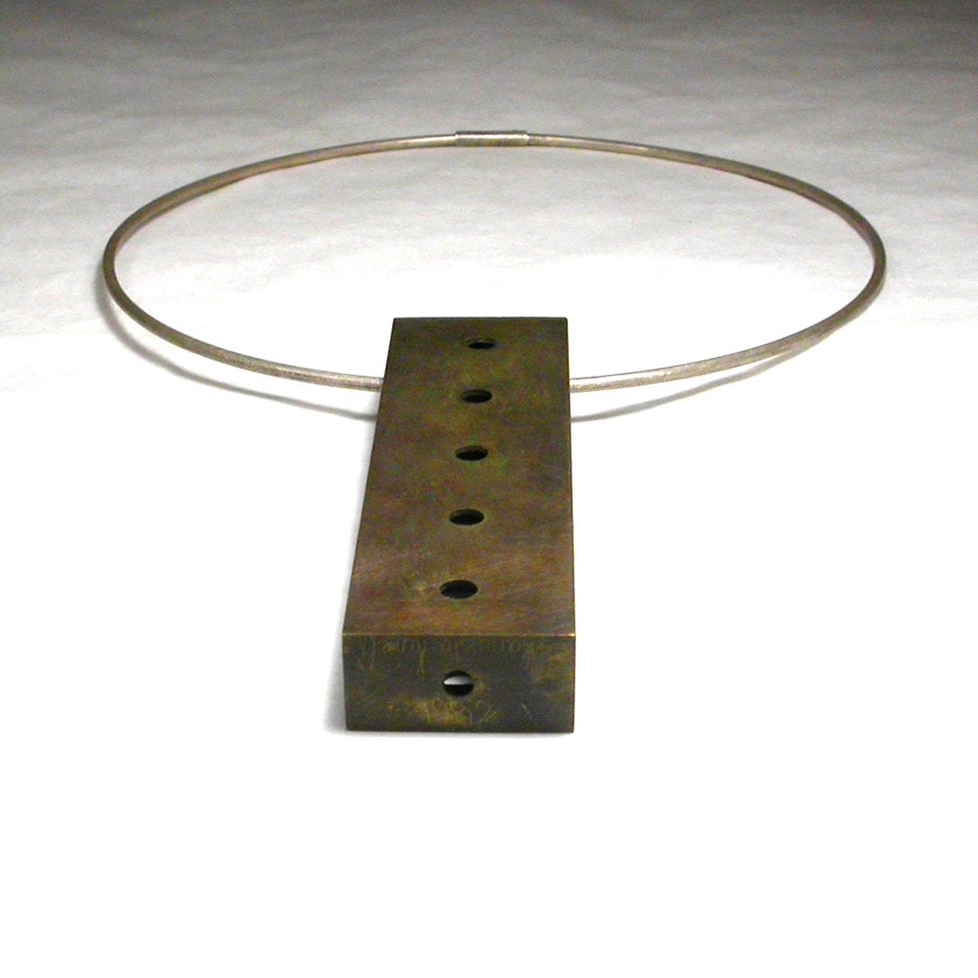 Soliloquy-Pendant-in-brass-on-a-sterling-silver-cable