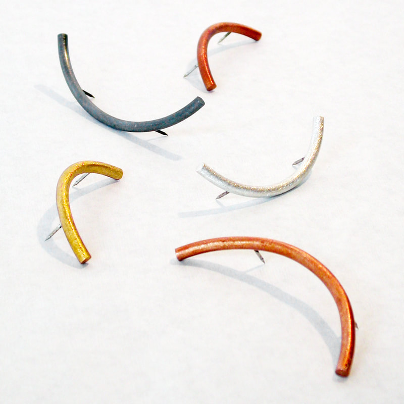 Colorful Arc Pins in several finishes