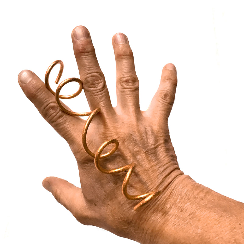 Coil Pin in copper on a hand