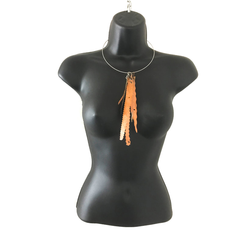 Copper Fall Necklace on black mannequin